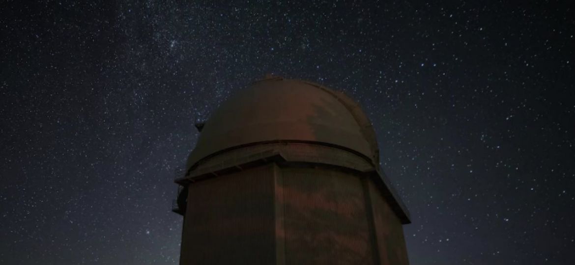 Giant professional telescope observing the night sky