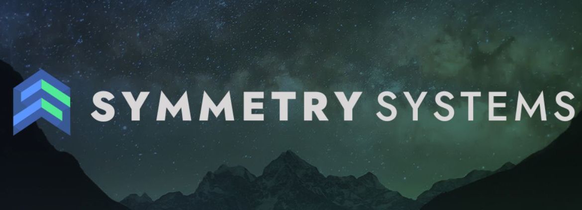 Symmetry Systems logo in front of mountains and night sky