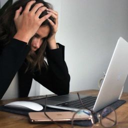 Woman frustrated working on her laptop